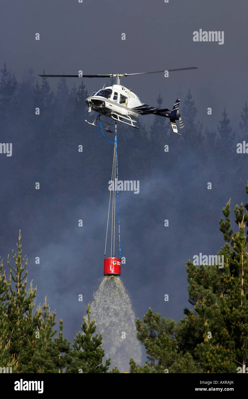 Helicopter Fighting Forest Fire Dunedin South Island New Zealand Stock Photo