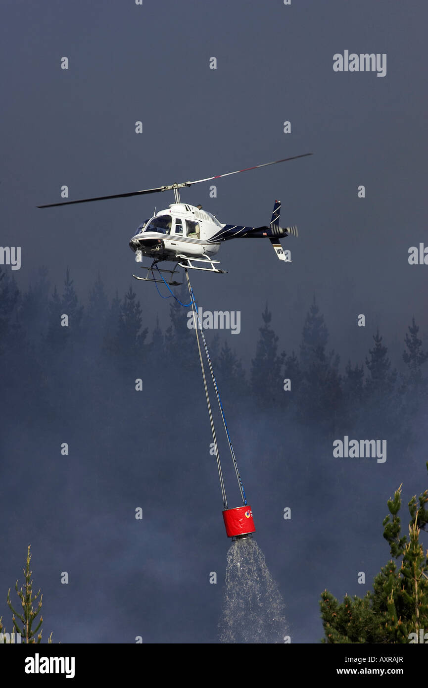 Helicopter Fighting Forest Fire Dunedin South Island New Zealand Stock Photo