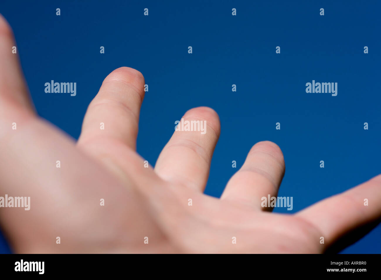 Hand reaching to the sky Stock Photo