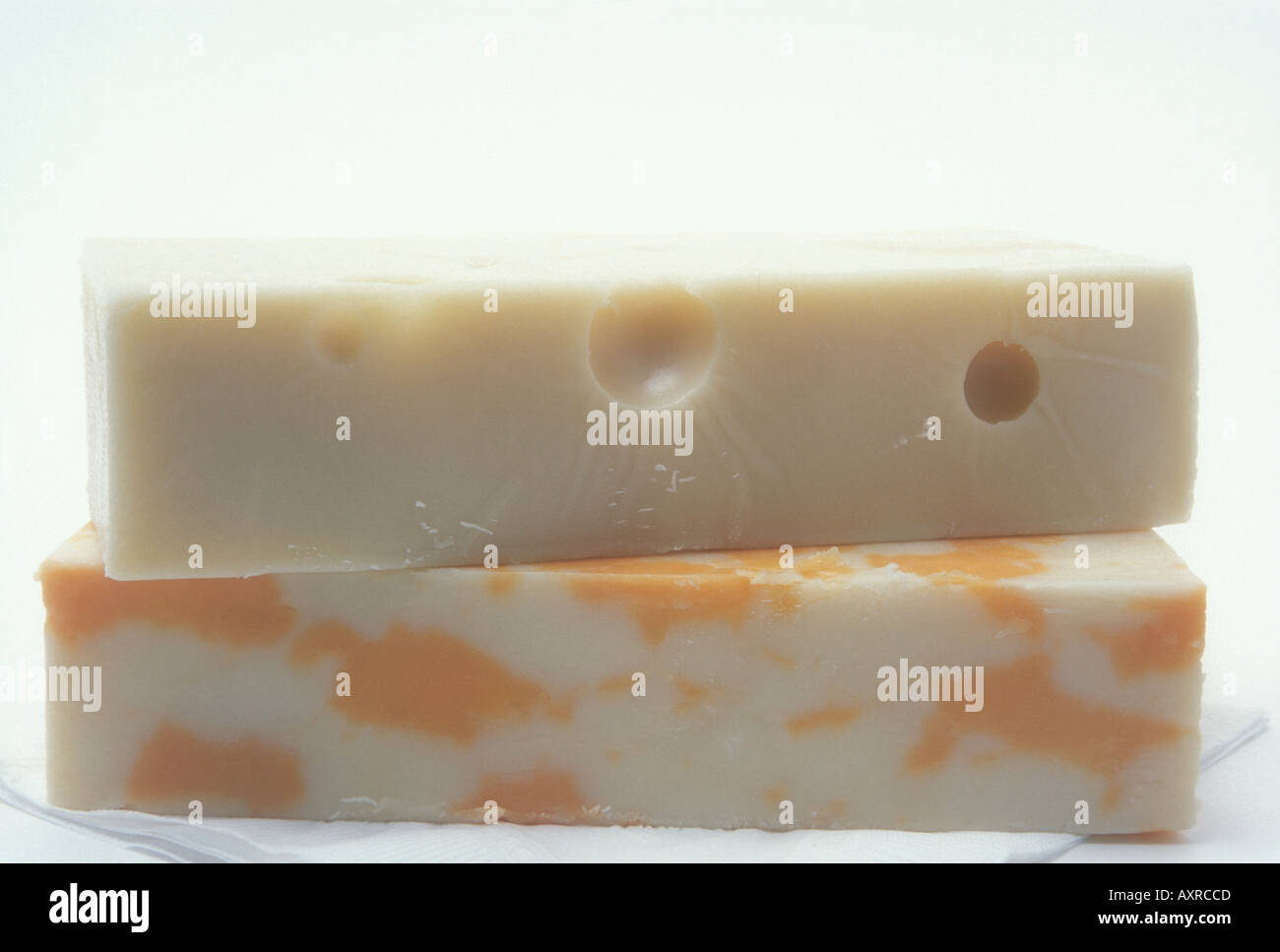 Hunks of swiss cheese and marble cheddar cheese hires stock