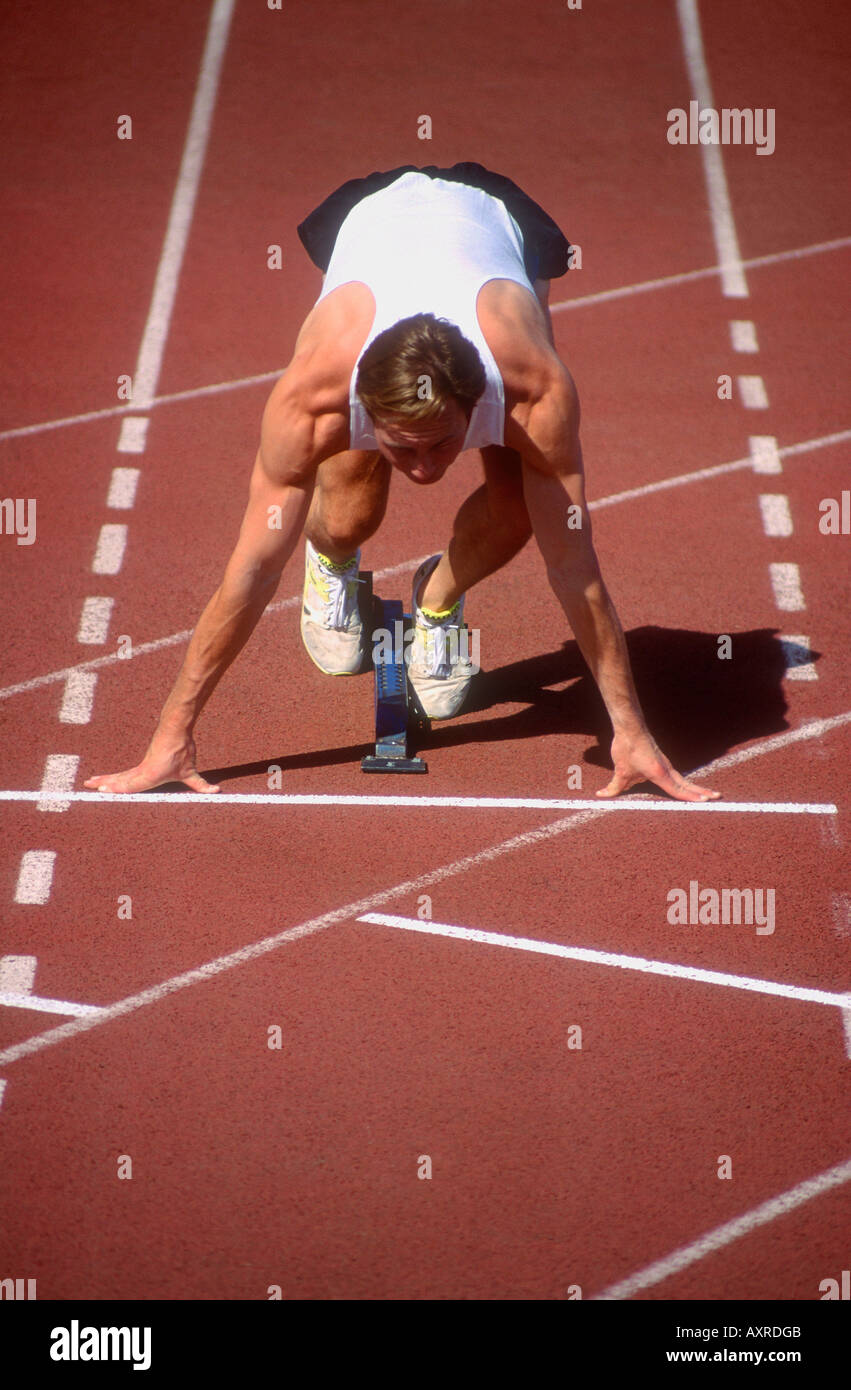 Male sprinters in starting blocks hires stock photography and images