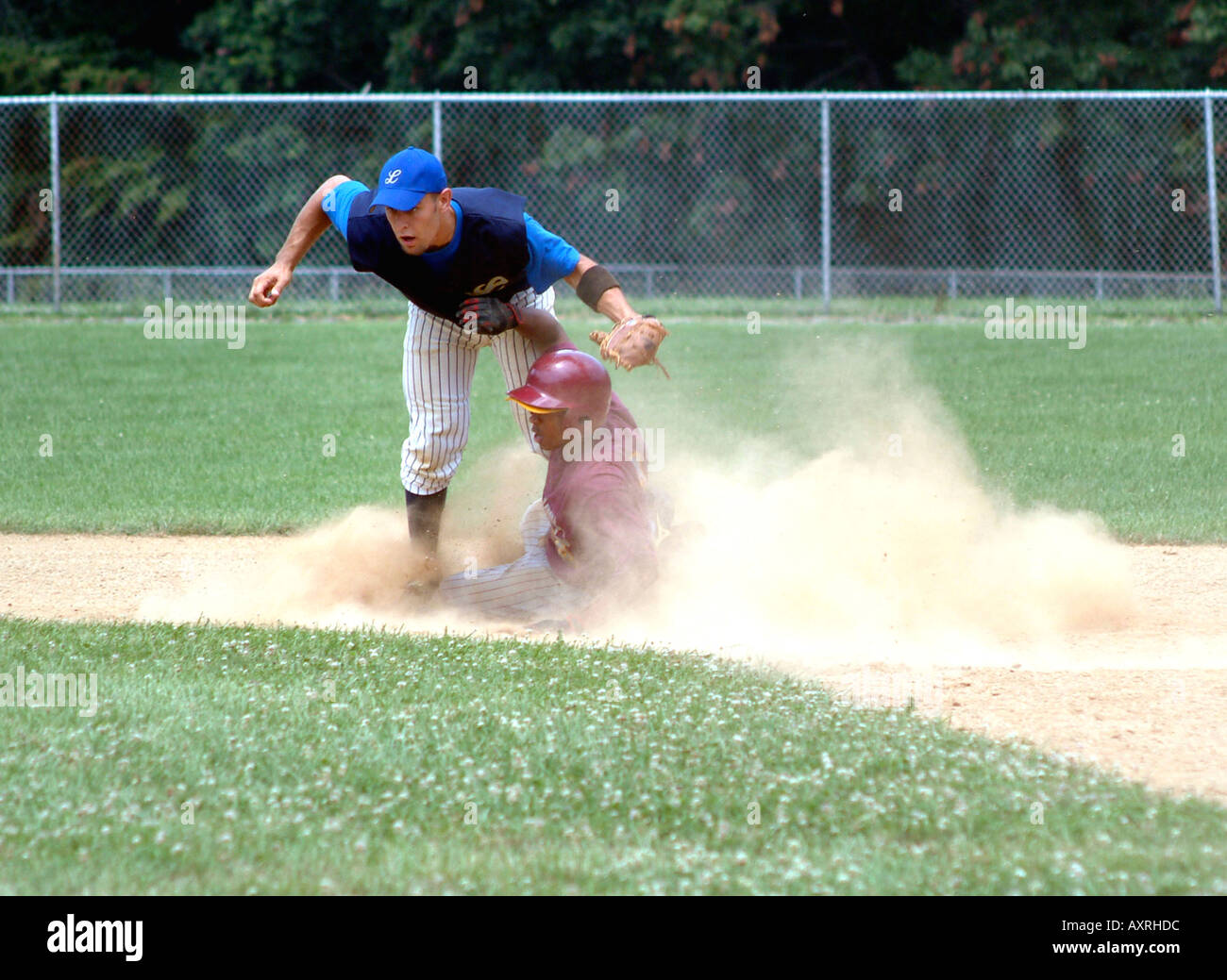 Player slides into 2nd base Stock Photo