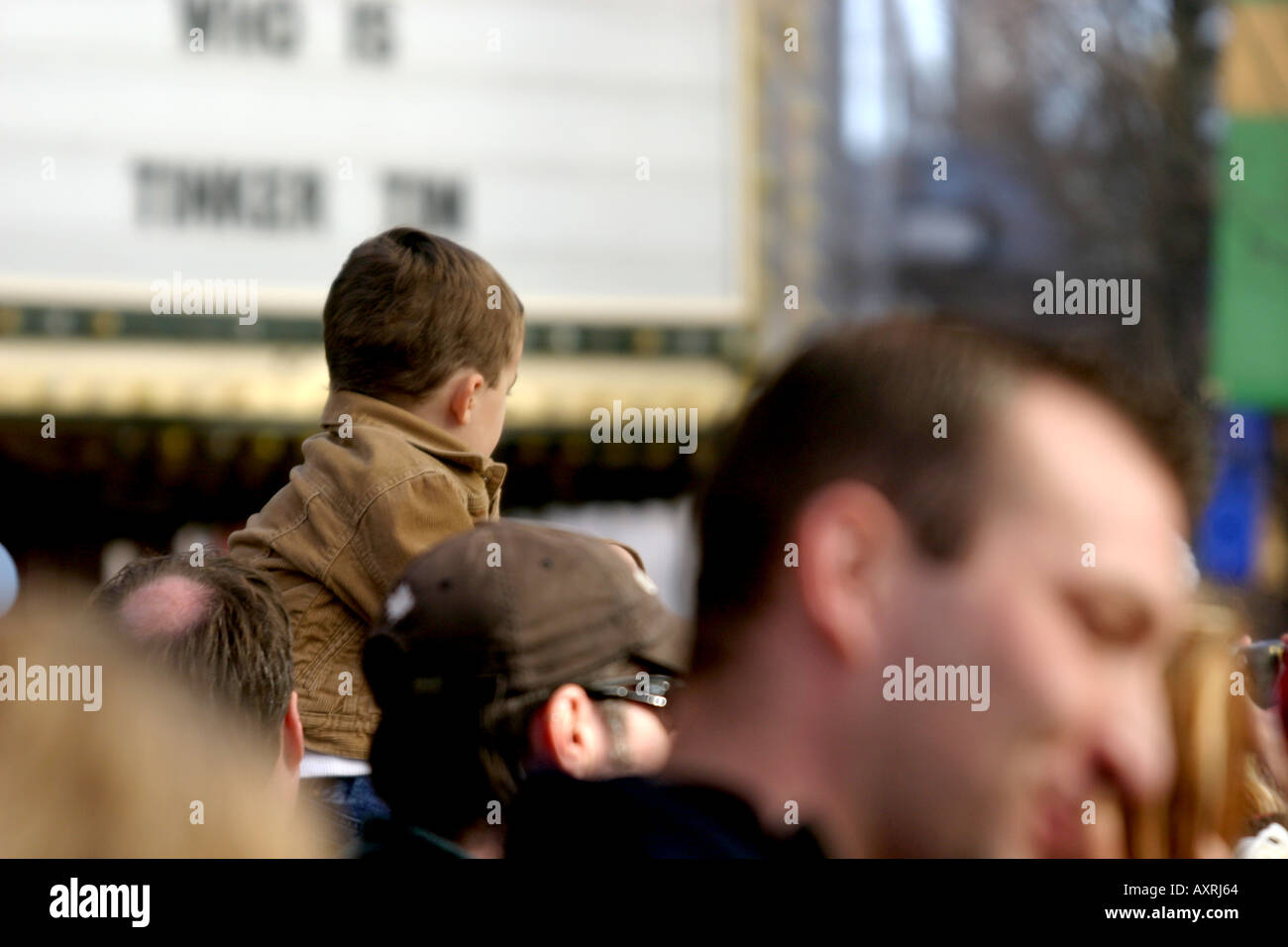 Small boy on his father's sholders watching the Santa Claus parade Stock Photo