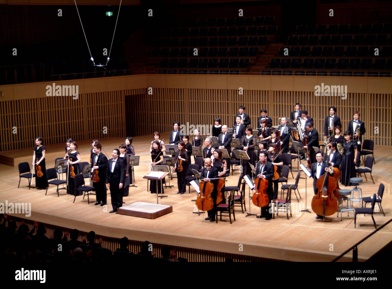 Conductor Shuntaro Sato and Kyoto Philharmonic Chamber Orchestra taking applause after a performance Kyoto Japan November 2005 Stock Photo