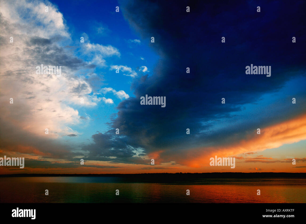 Sunset over water Stock Photo - Alamy