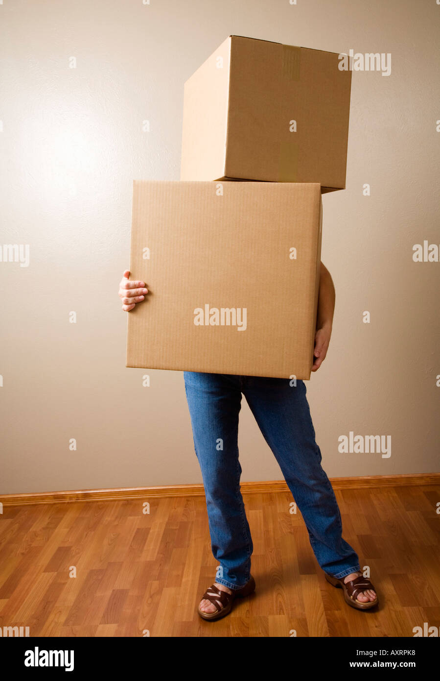 Woman carrying heavy boxes Stock Photo Alamy