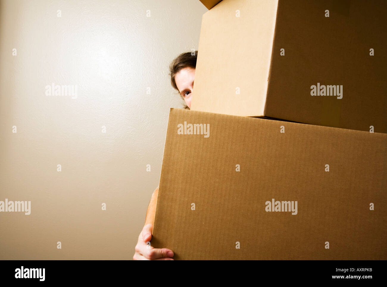 Woman carrying heavy boxes Stock Photo Alamy