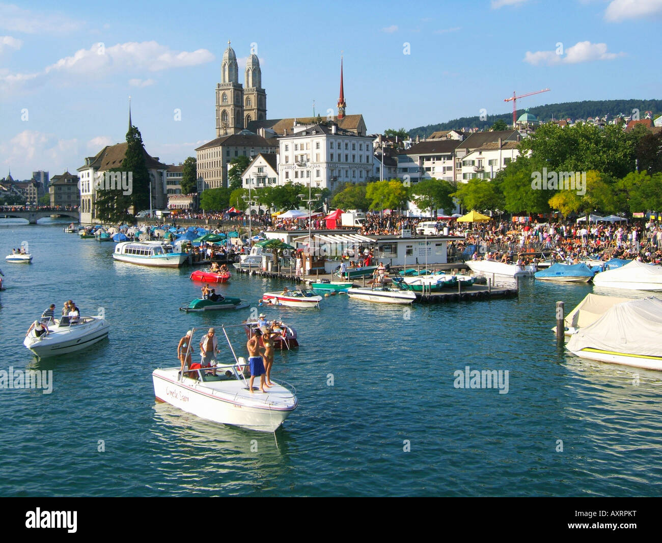 Switzerland Zurich street parade party boats on river Limmat Grossmuenster skyline Zuerich Stock Photo