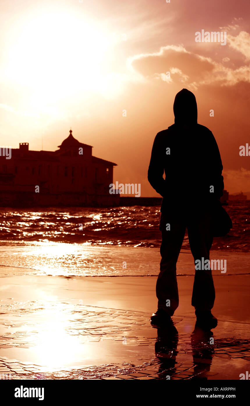 Silhouette man in hood standing hi-res stock photography and images - Alamy