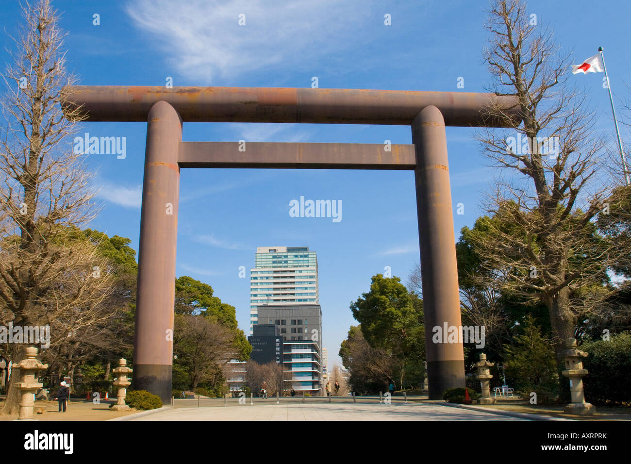 Giant red steel torii gate at entrance to Yasukuni jinja shrine commemorating war dead in Tokyo Japan Stock Photo