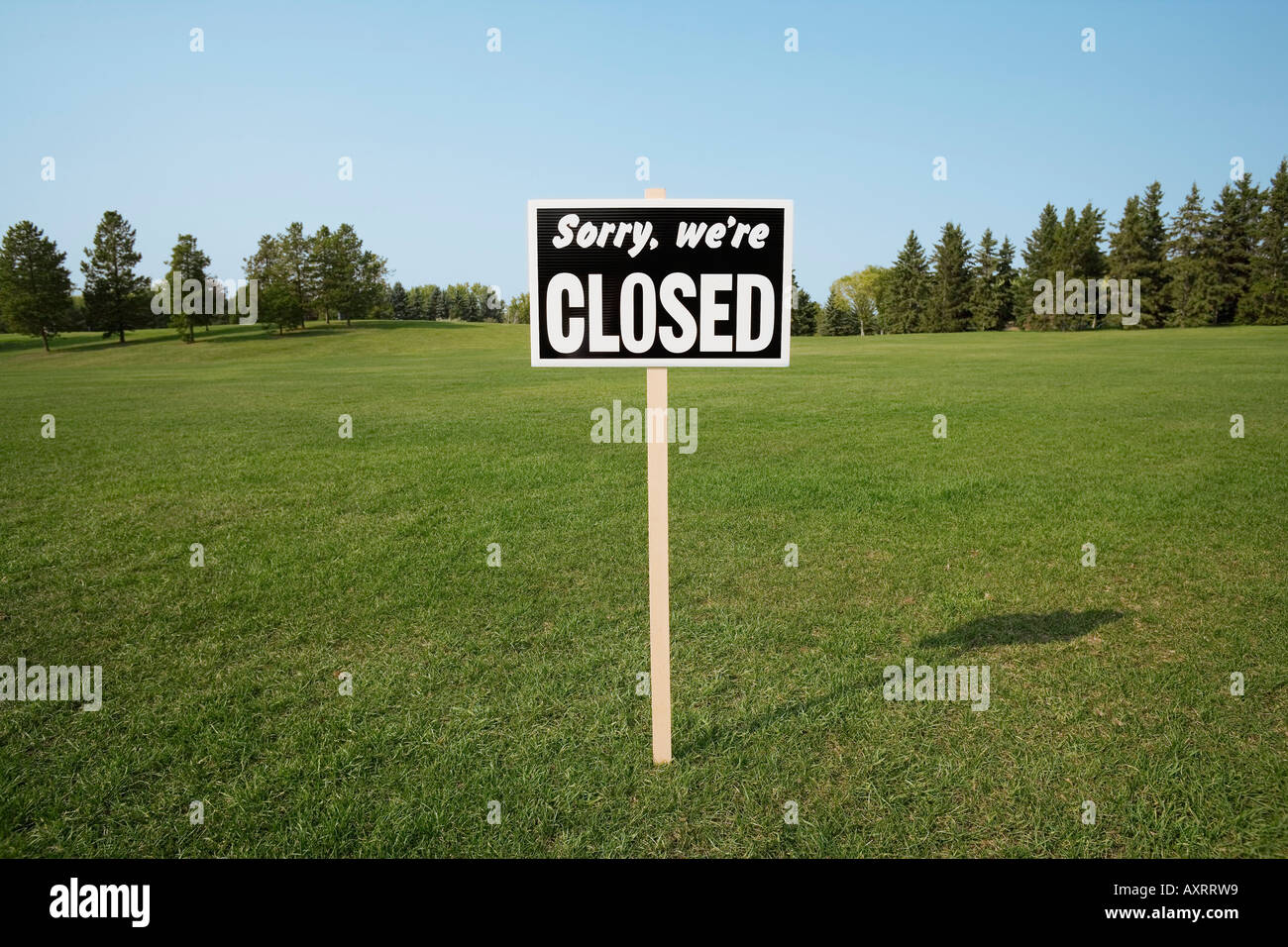 Closed sign outside in field Stock Photo