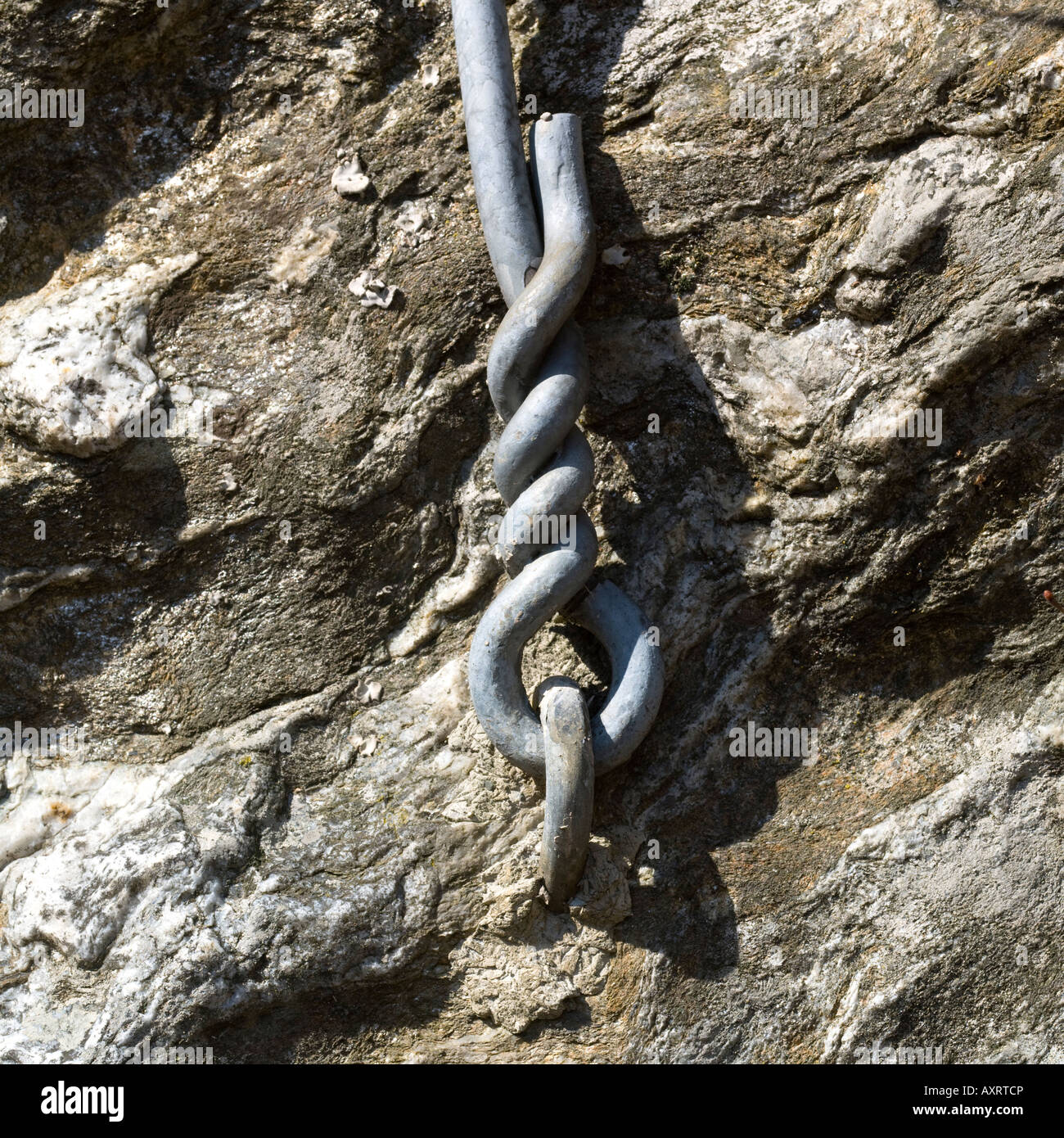 Stone with anchor bolt, Italian Alps, Italy Stock Photo