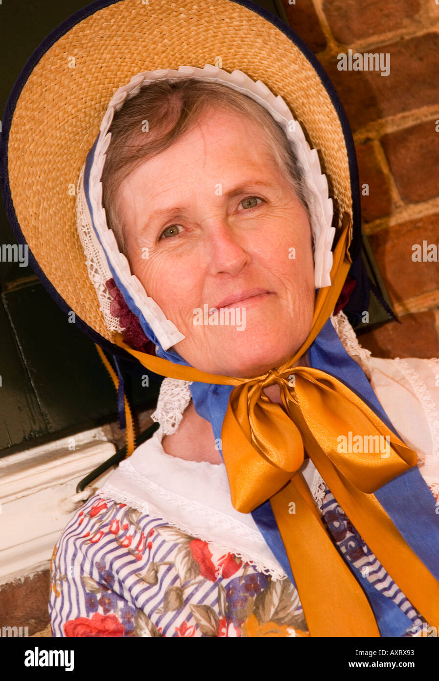 Close-up of a woman wearing a traditional bonnet in Old Salem, North Carolina, showcasing historical attire and heritage. Stock Photo