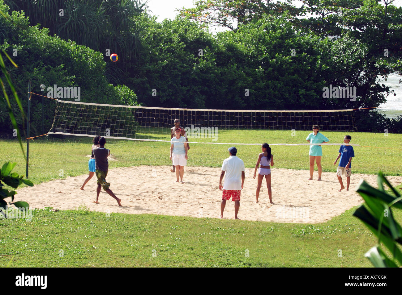 People playing beach volleyball at the Taj Exotica Hotel, Bentota, Sri