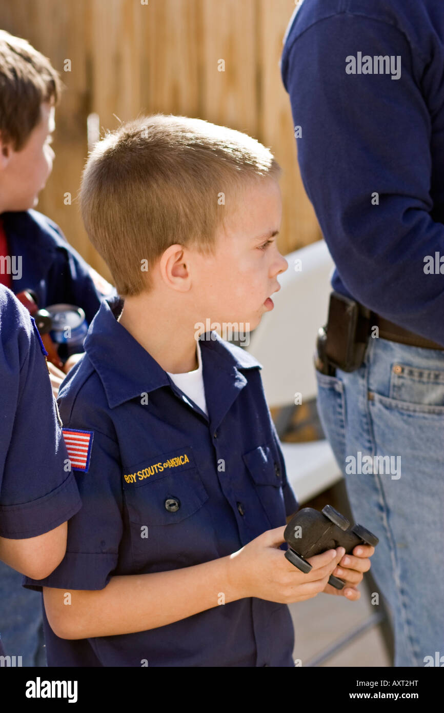 Boy holding cub scouts Pinewood Derby car Stock Photo Alamy