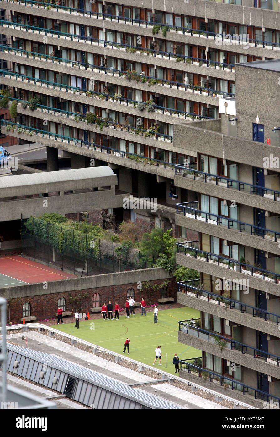 Children play in an inner city playground surrounded by high rise flats near Barbican central London Stock Photo