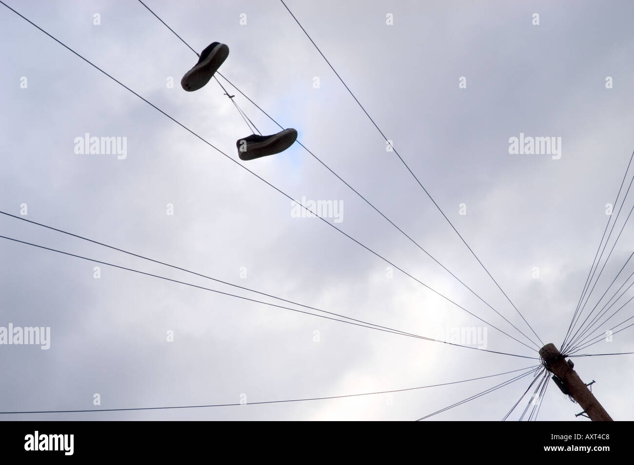 Trainers hanging from a telephone wire Stock Photo Alamy