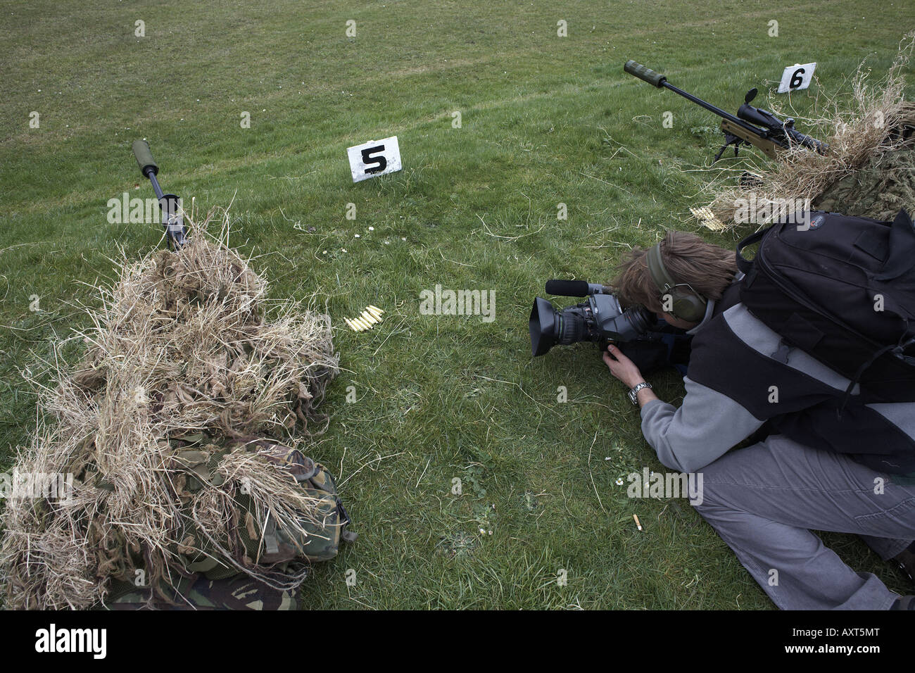 British Army Infantry soldiers demonstrate their newest L115A3 sniper rifle on firing ranges to filming TV media Stock Photo