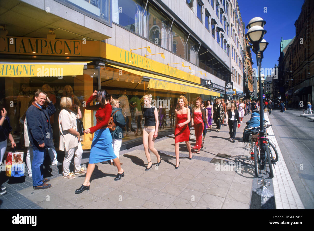 Fashion models and pedestrians on streets of Stockholm at Normalmstorg in summer Stock Photo