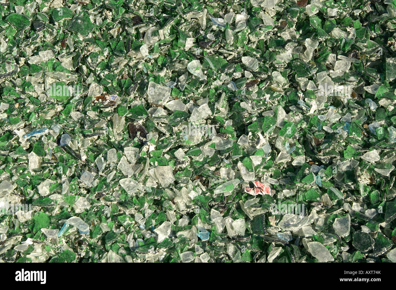 Pieces of green and white glass at recycling plant / Grüne und weiße Glasbruchstücke in Altglasrecyclingfrima Stock Photo