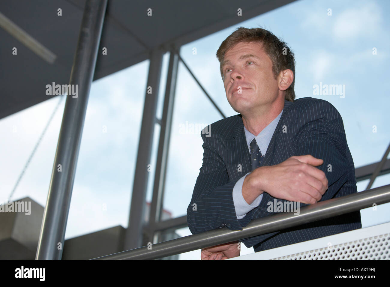 Man in entrance of building Stock Photo - Alamy