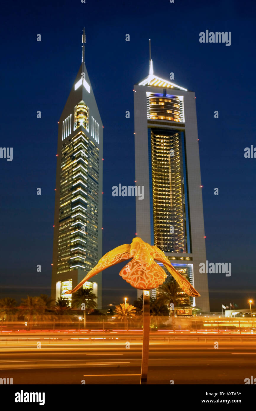 Dubai Sheikh Zayed Road skyscraper Emirates towers skyline sculpture of a falcon Stock Photo