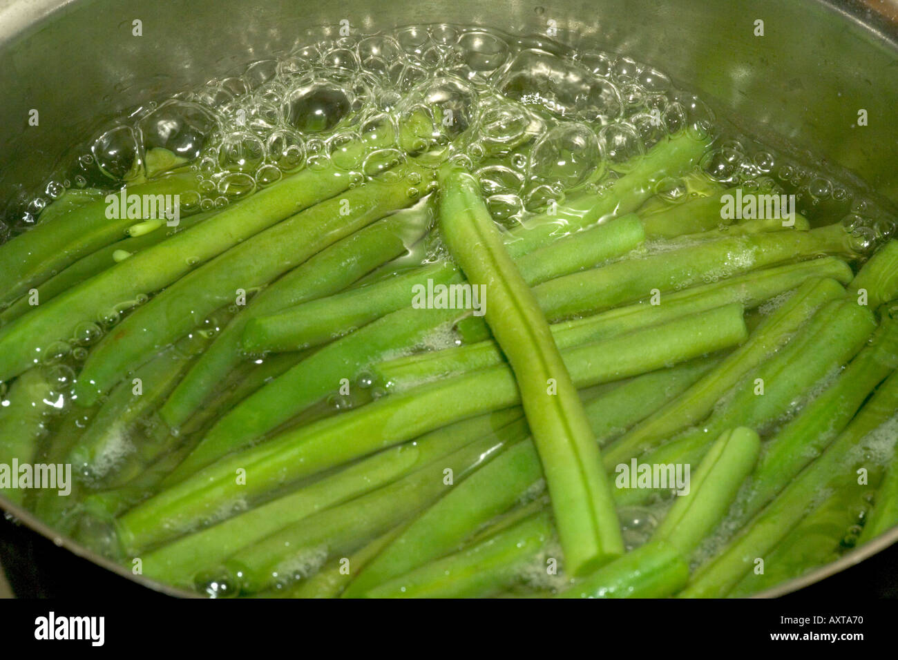 Organic Beans Cooking in Saucepan Stock Photo