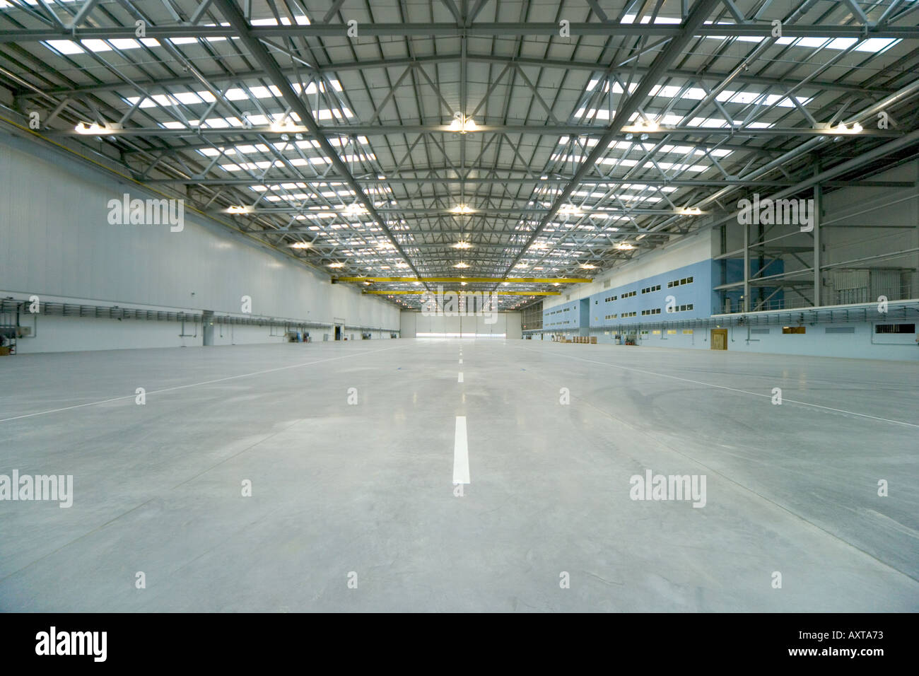 Large empty aircraft hangar workshop floor Stock Photo