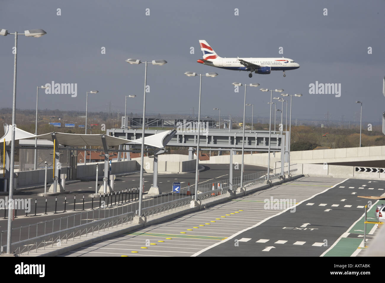 British Airways Airbus lands over unused car parking bays outside newly