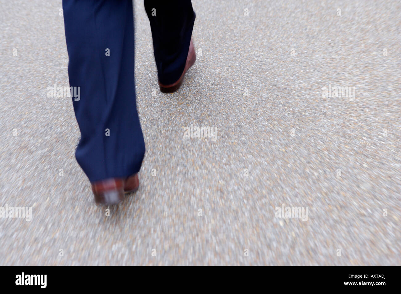 Feet of man walking on street Stock Photo - Alamy