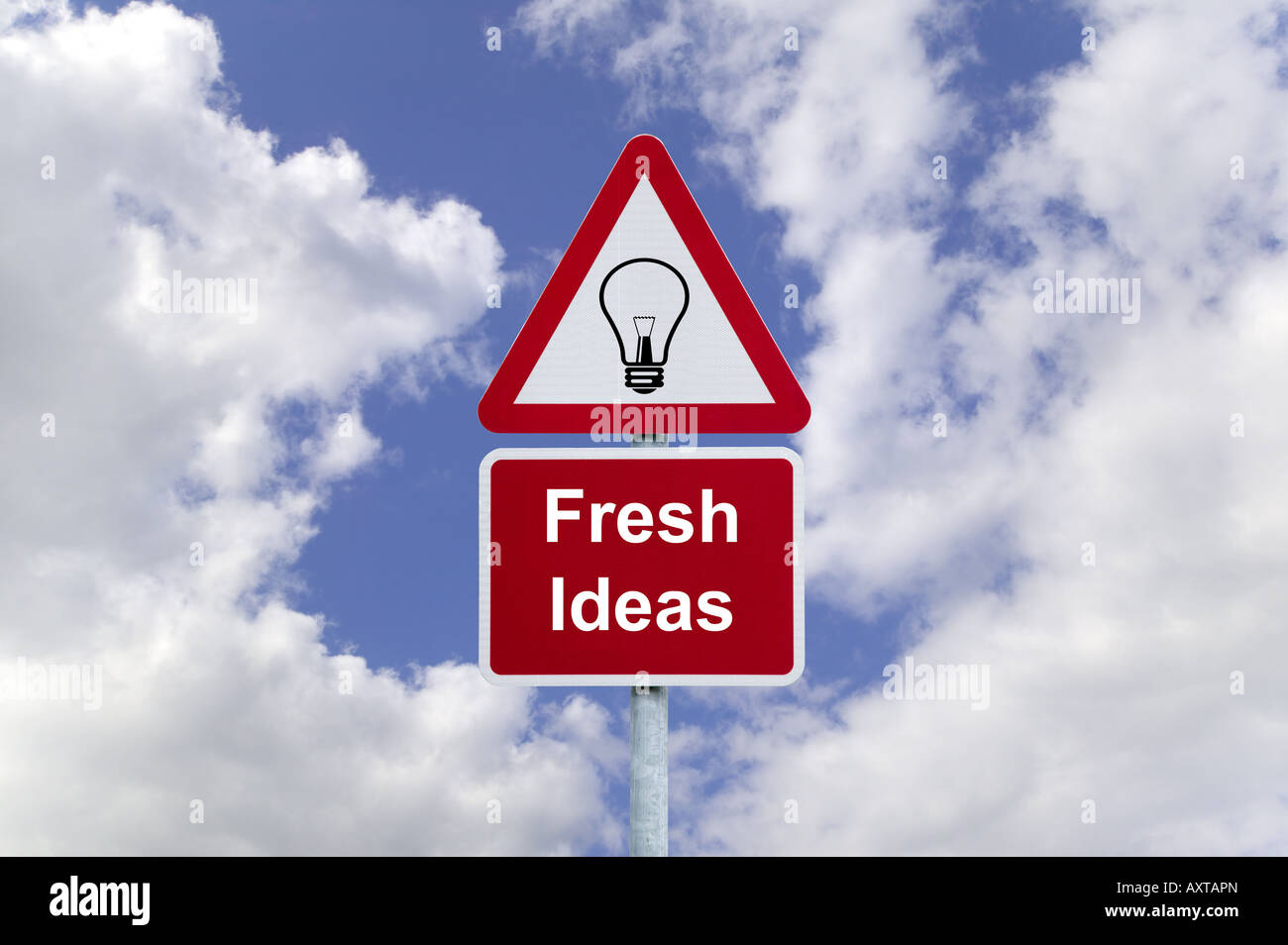 Signpost for Fresh Ideas against a blue cloudy sky business concept image Stock Photo