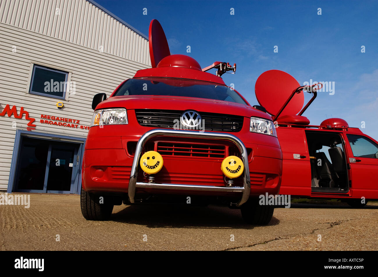 Two volkswagen satellite trucks displayed outside the factory of the integrators Megahertz Broadcast Systems Ltd Stock Photo
