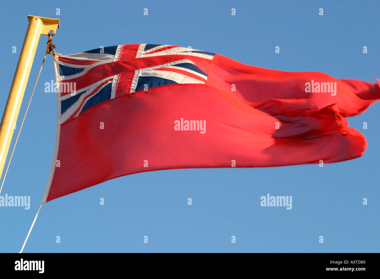 Royal Ensign flying against blue sky Stock Photo