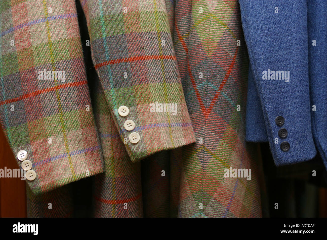 sleeves of tartan jackets in shop Stock Photo