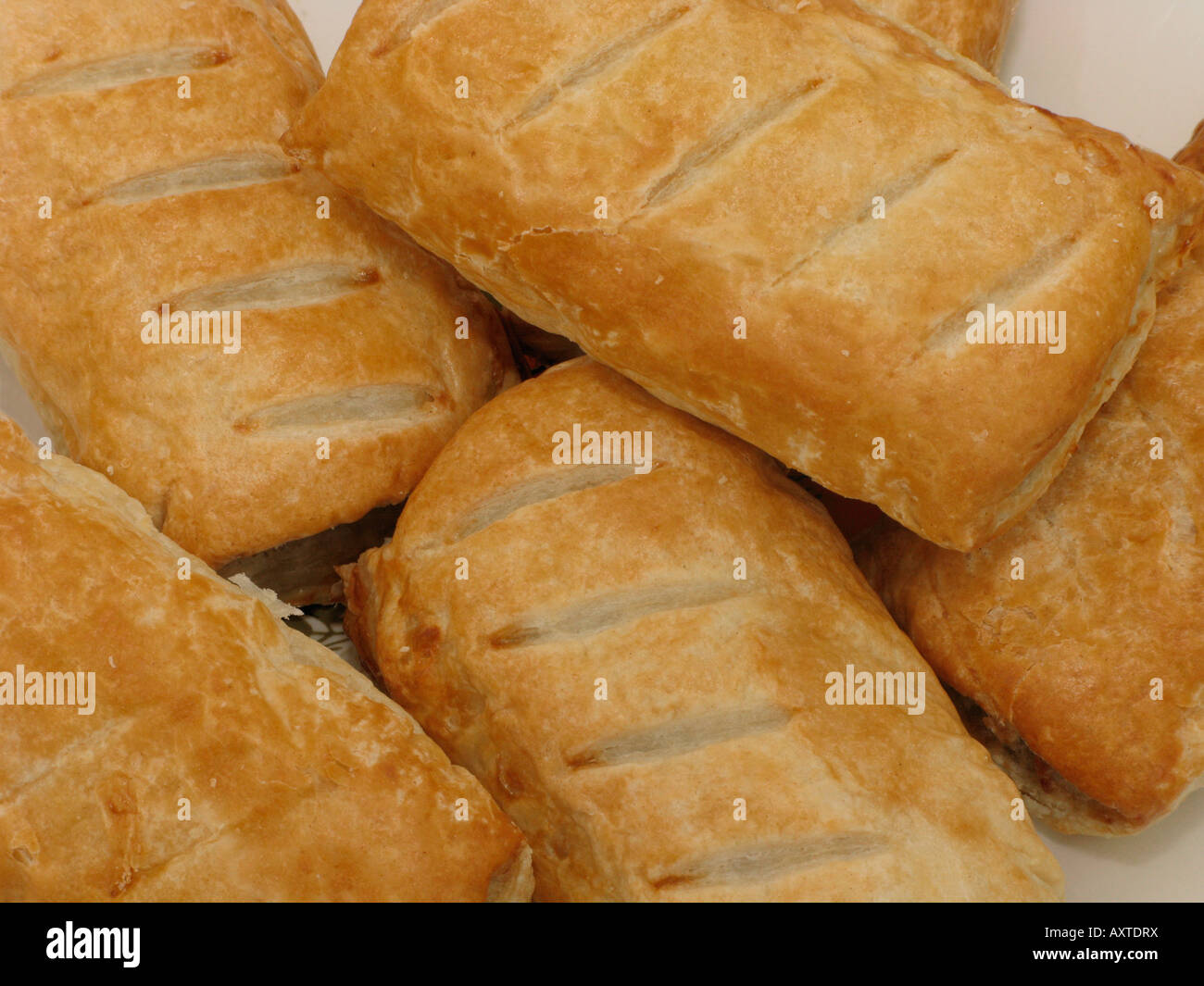 plate of sausage rolls unhealthy eating Stock Photo Alamy