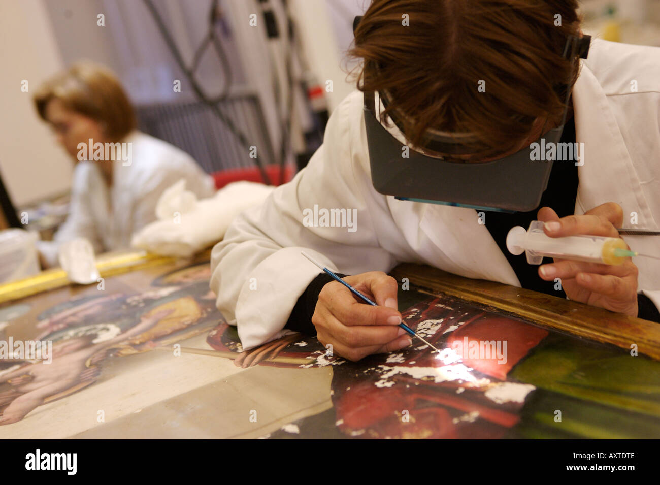 Art restorers working on paintings in Murcia, Spain Stock Photo Alamy