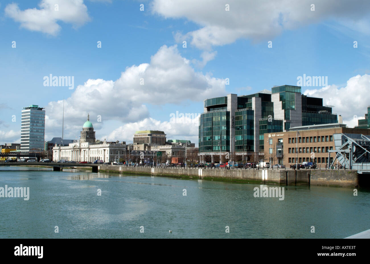 IFSC House and the AIB Trade Centre Building seen from the Sean O Casey Pedestrian Bridge over the River Liffey Dublin Ireland Stock Photo
