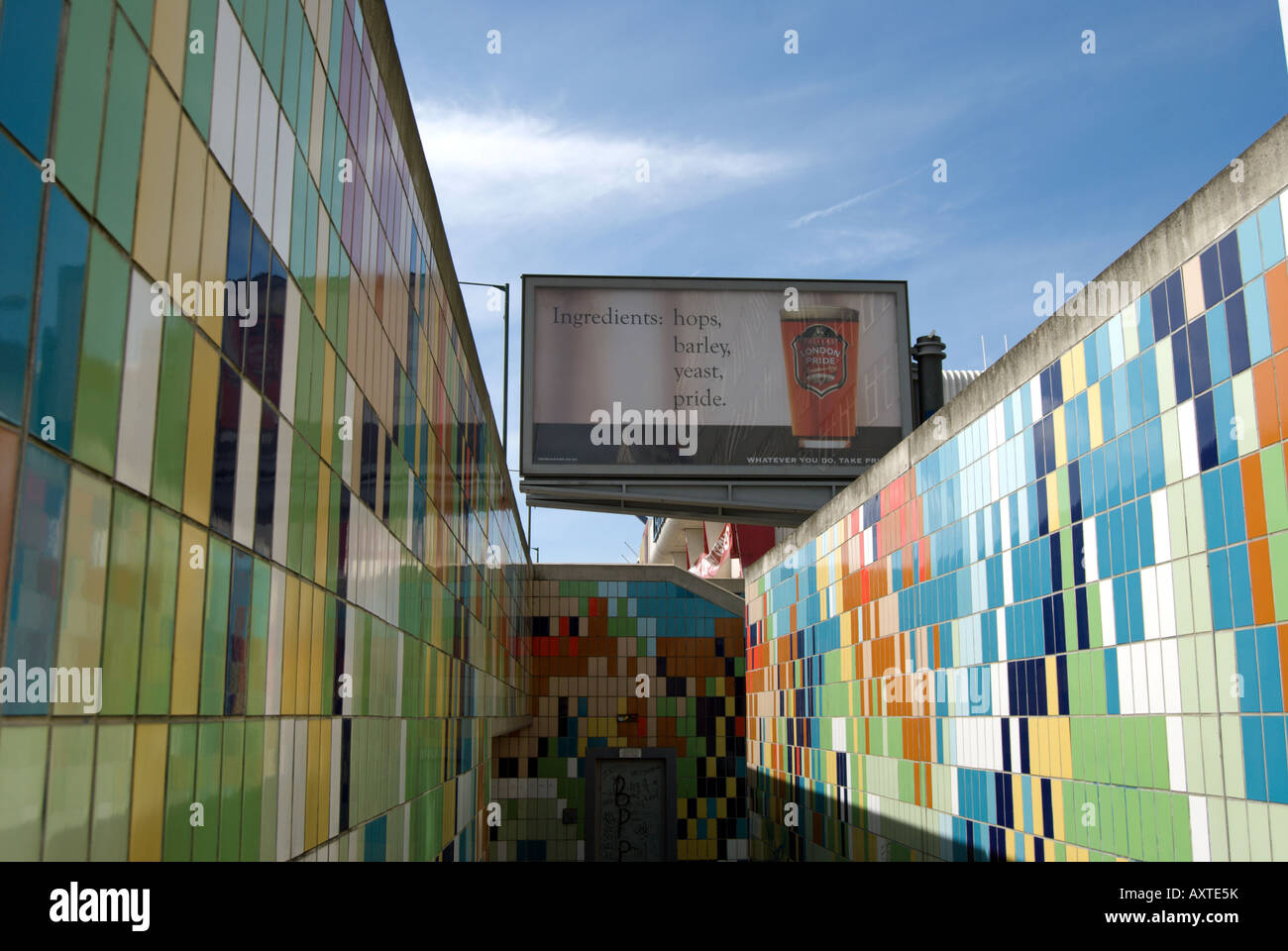 billboard advertisement rises above the mutlicoloured walls of a