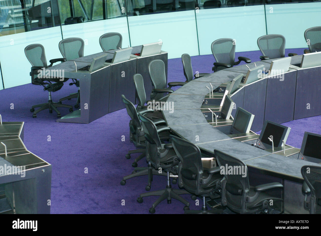 a meeting being held in London s City Hall using the hi tech facilities Stock Photo
