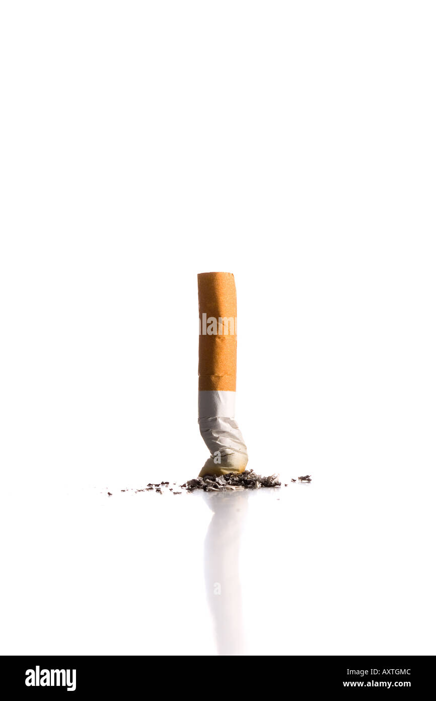 stubbing out a cigarette Stubbed out cigarette Stock Photo