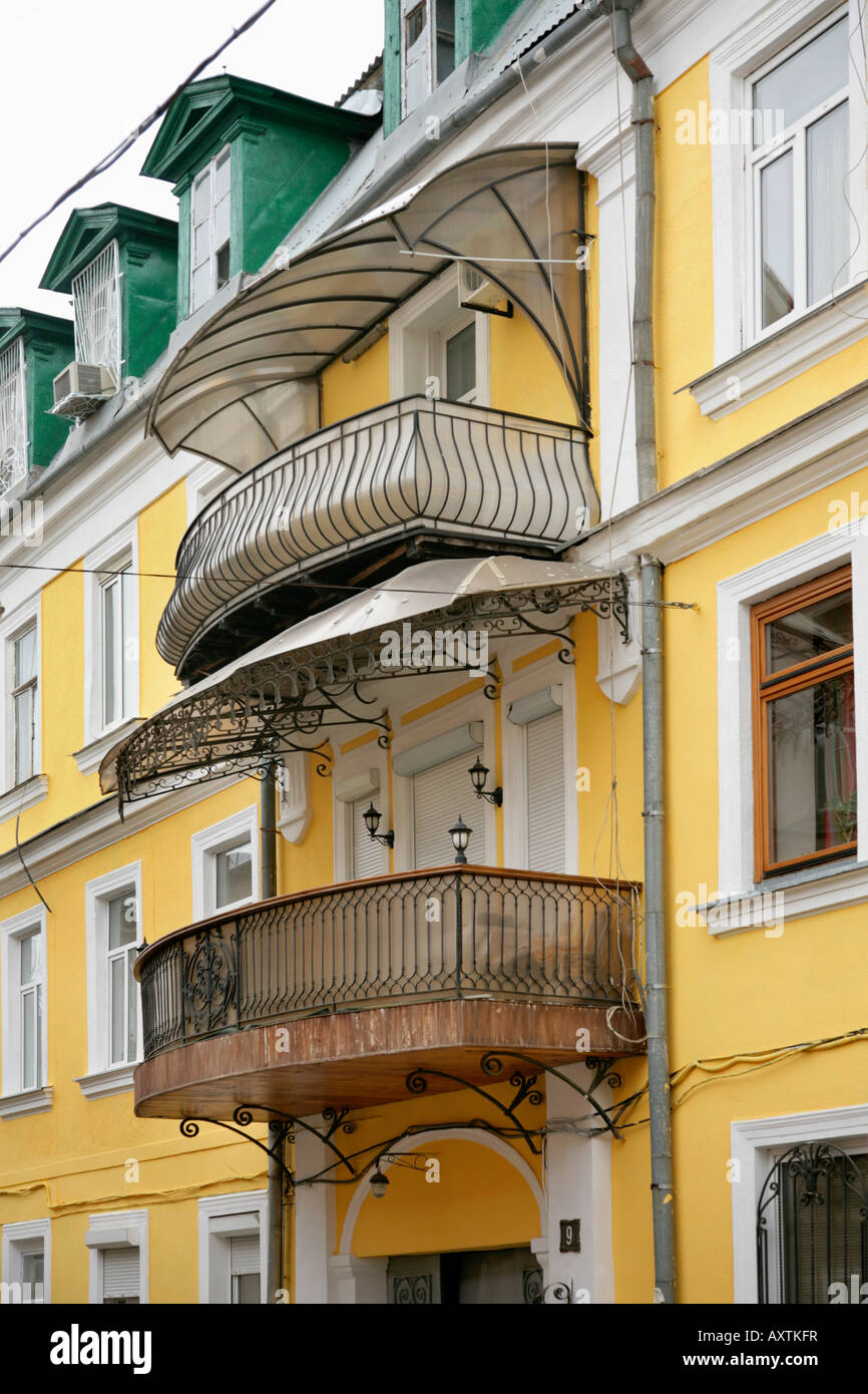 Detail of ornate wrought iron balconies and canopies on building in ...