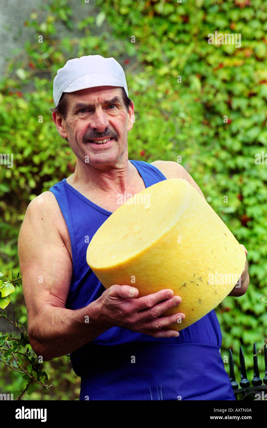 Award winning cheese maker Leon Downey with a finished cheese at Llangloffan Farm Castle Morris