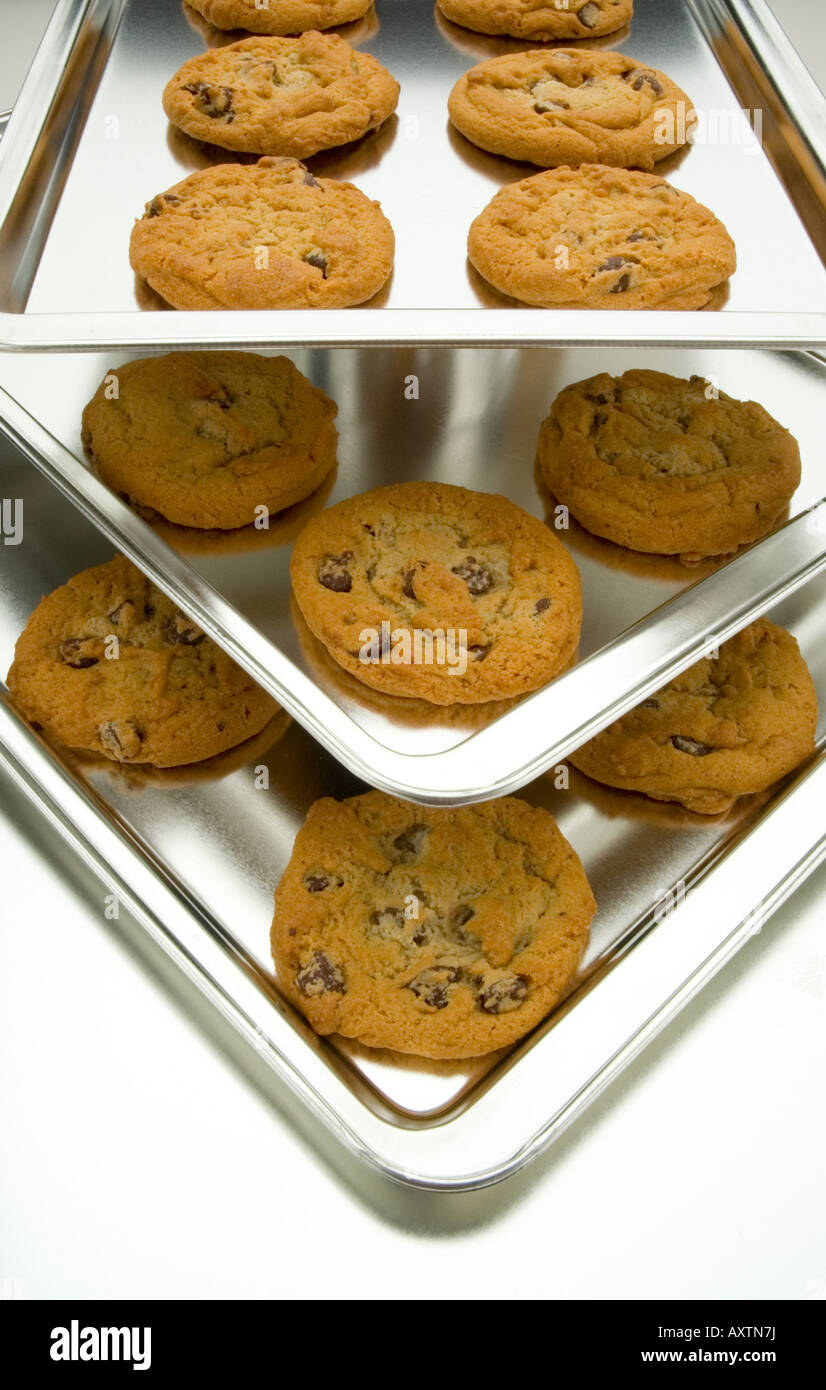 Chocolate chip cookies cooling on trays Stock Photo Alamy