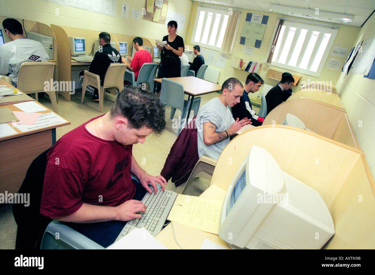 Inmates using computer suite at HMP Parc Bridgend Wales UK Stock Photo
