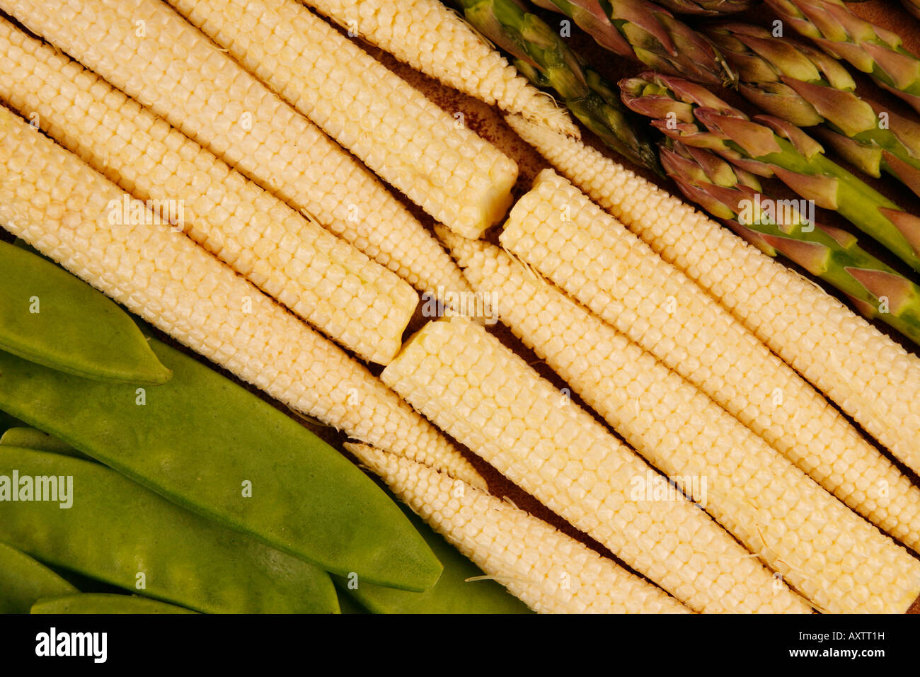 Baby corn, mange touts and asparagus Stock Photo Alamy