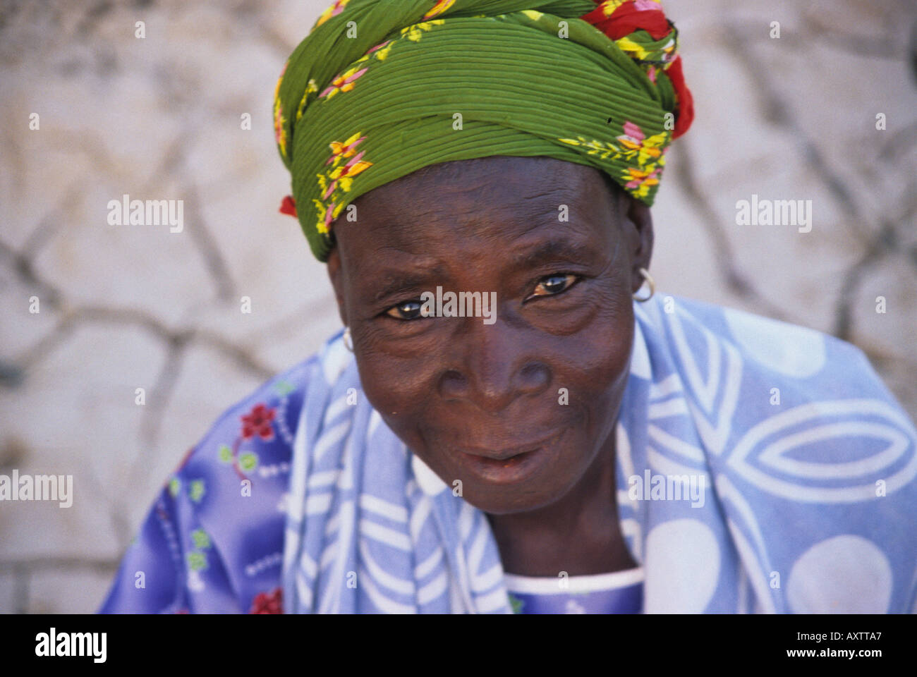 Portrait of an African woman standing in dry river bed, Burkina Faso ...