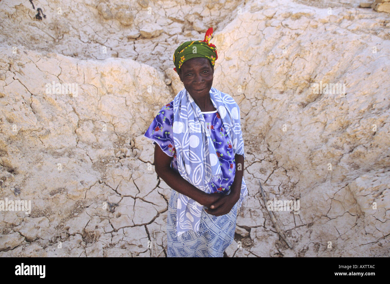 Woman Standing In A Dry River Bed Burkina Faso West Africa Stock