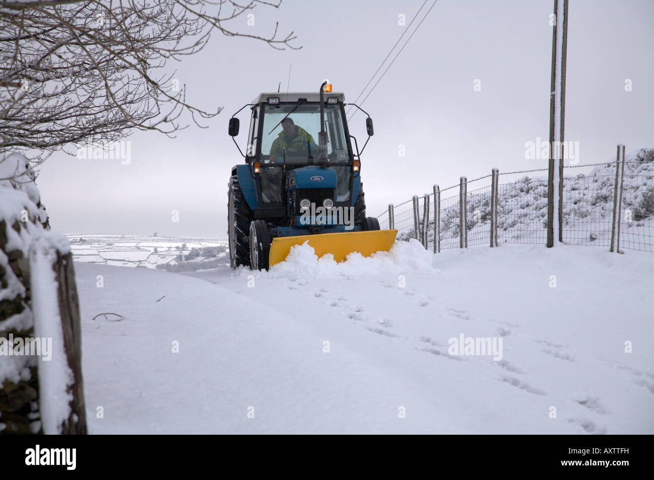 Tractor Snow Plough Clearing Road High Resolution Stock Photography and