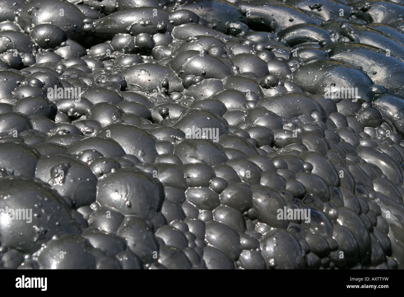 Close up of bubbles in gold froth flotation tank for separating out very fine free gold and gold bearing particles Stock Photo