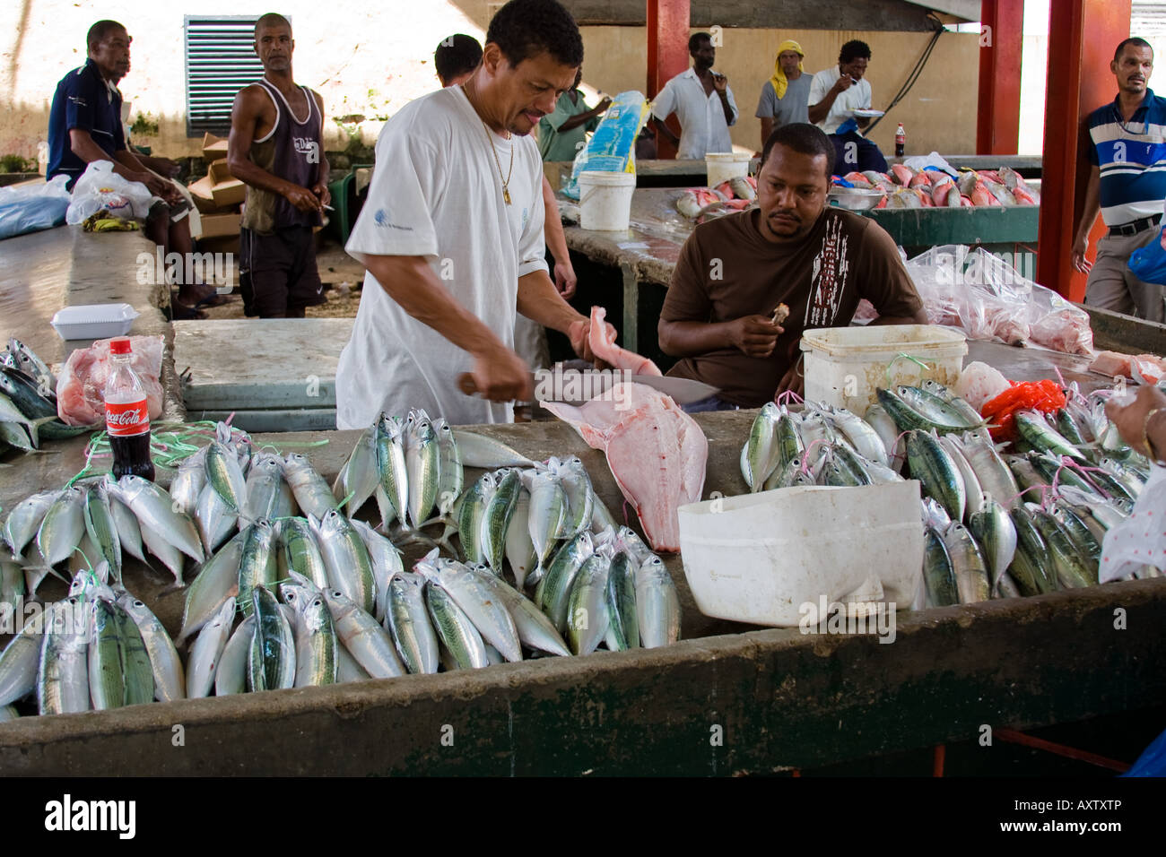 Fishmonger cutting fish in Victoria market, Seychelles Stock Photo - Alamy